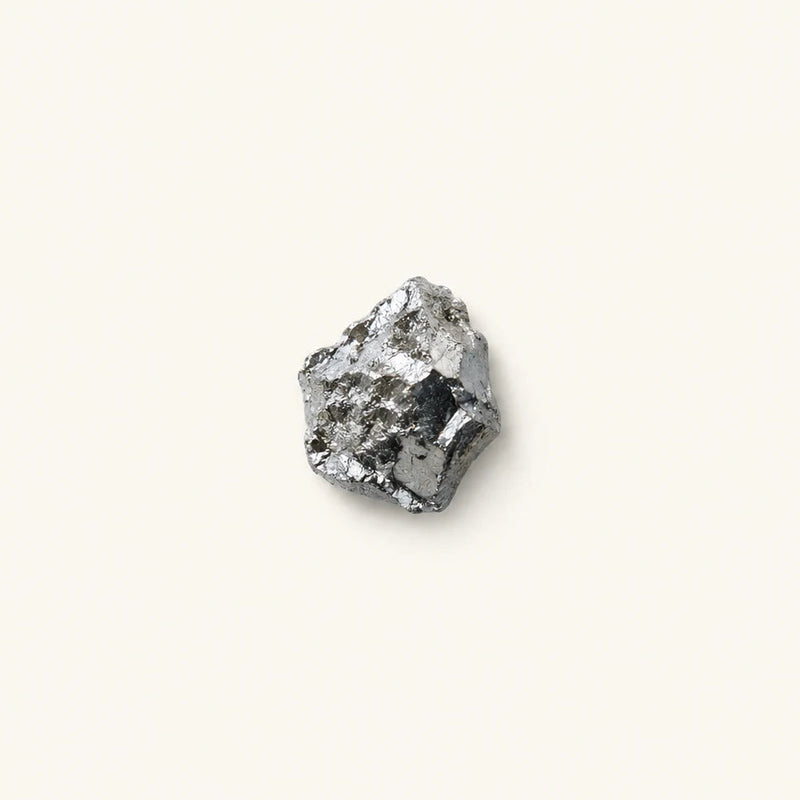 A small piece of Chromium picolinate on a white background
