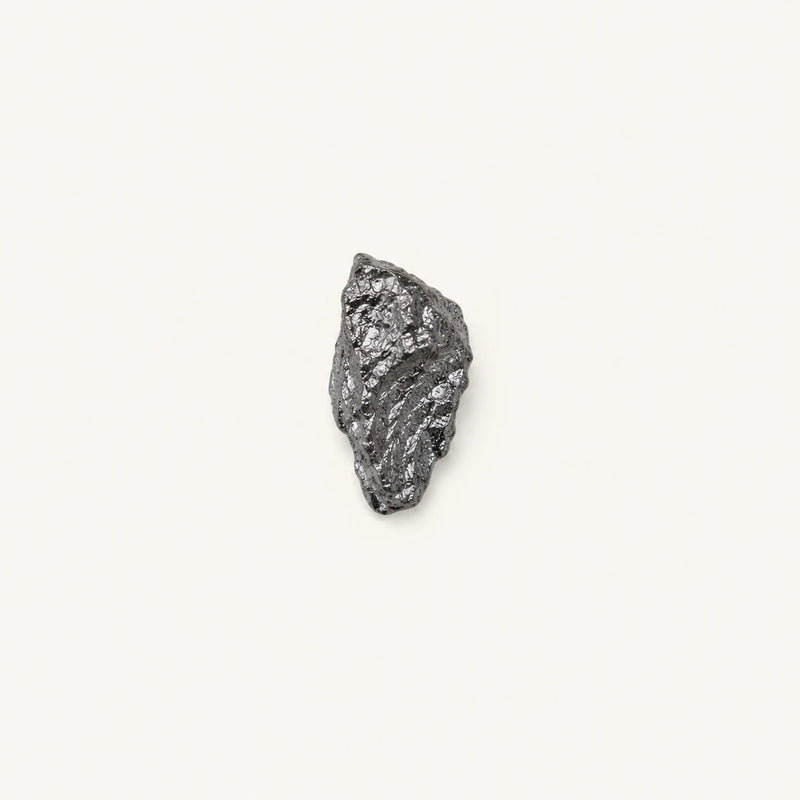 A small piece of Selenomethionine on a white background